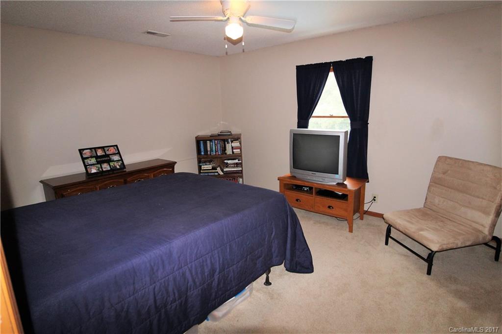 827 Brian Road, Unit 5 Clover, SC 29710 - Photo 13 of 21 a bedroom with a bed and a flat screen tv