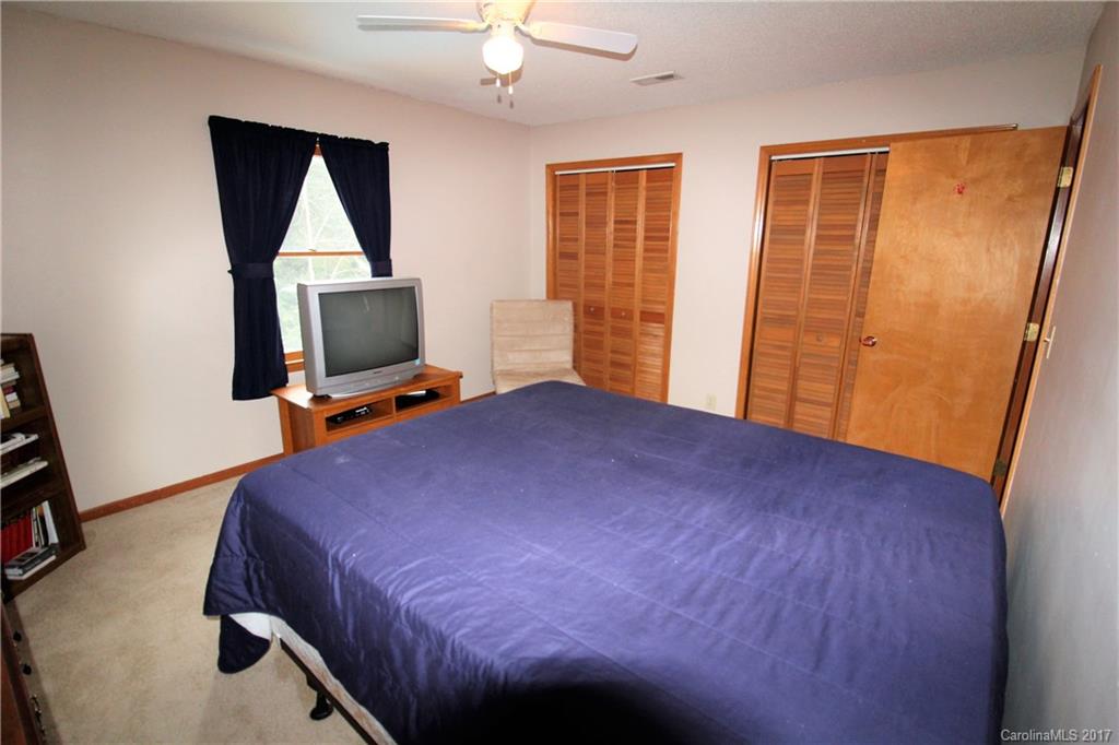 827 Brian Road, Unit 5 Clover, SC 29710 - Photo 14 of 21 a bedroom with a bed and a flat tv screen