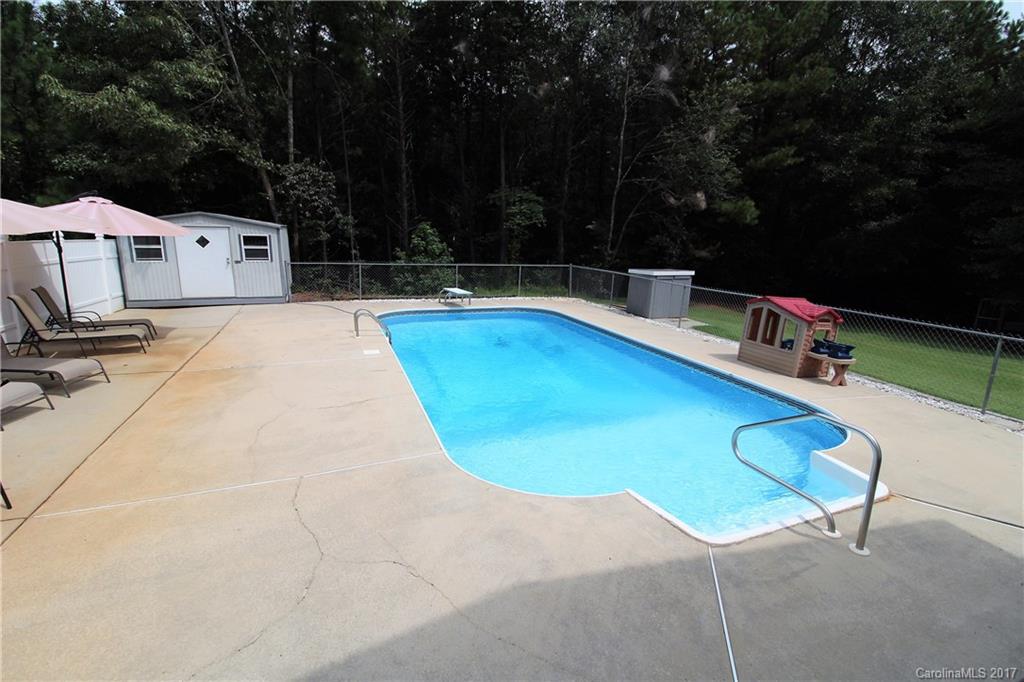 827 Brian Road, Unit 5 Clover, SC 29710 - Photo 18 of 21 a view of a swimming pool with a lounge chair