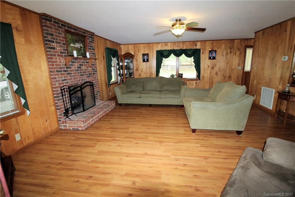 827 Brian Road, Unit 5 Clover, SC 29710 - Photo 6 of 21 a living room with fireplace furniture and a flat screen tv