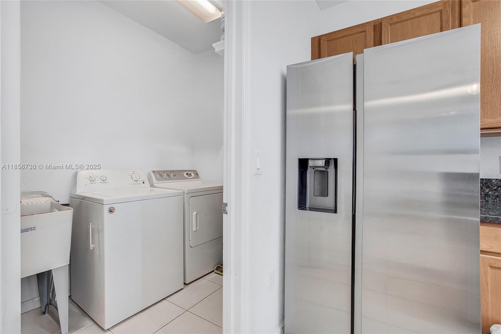2621 Southwest 120th Terrace, Unit 2032 Miramar, FL 33025 - Photo 15 of 18 a utility room with dryer and washer