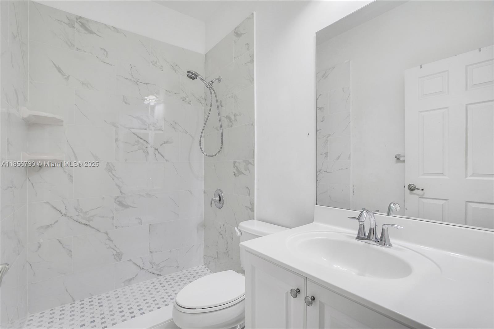 2621 Southwest 120th Terrace, Unit 2032 Miramar, FL 33025 - Photo 10 of 18 a bathroom with a sink a toilet and shower