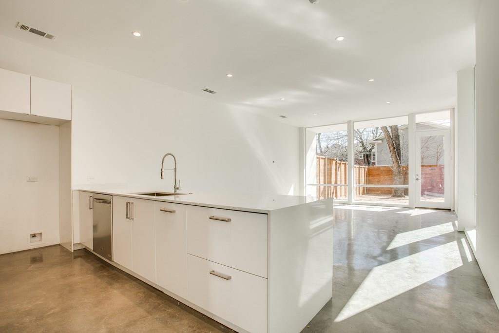 5801 Bryan Parkway Dallas, TX 75206 - Photo 5 of 16 a kitchen with a sink and cabinets