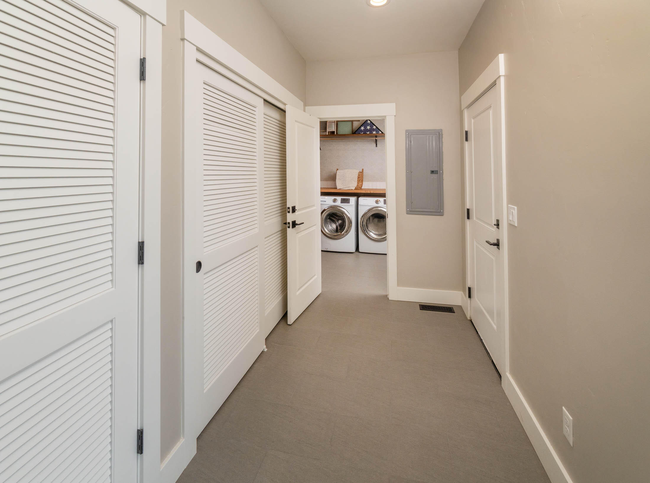 23160 Rickard Road Bend, OR 97702 - Photo 13 of 48 Laundry, and hallway from garage and appt entrance.
