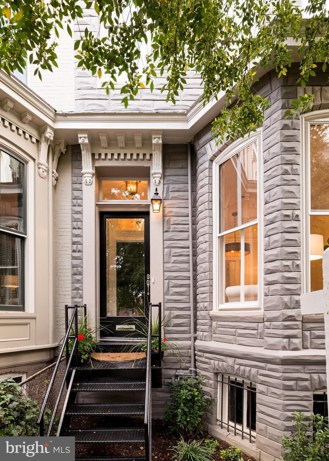 1833 12th Street Northwest Washington, DC 20009 - Photo 2 of 30 a front view of a house with a balcony