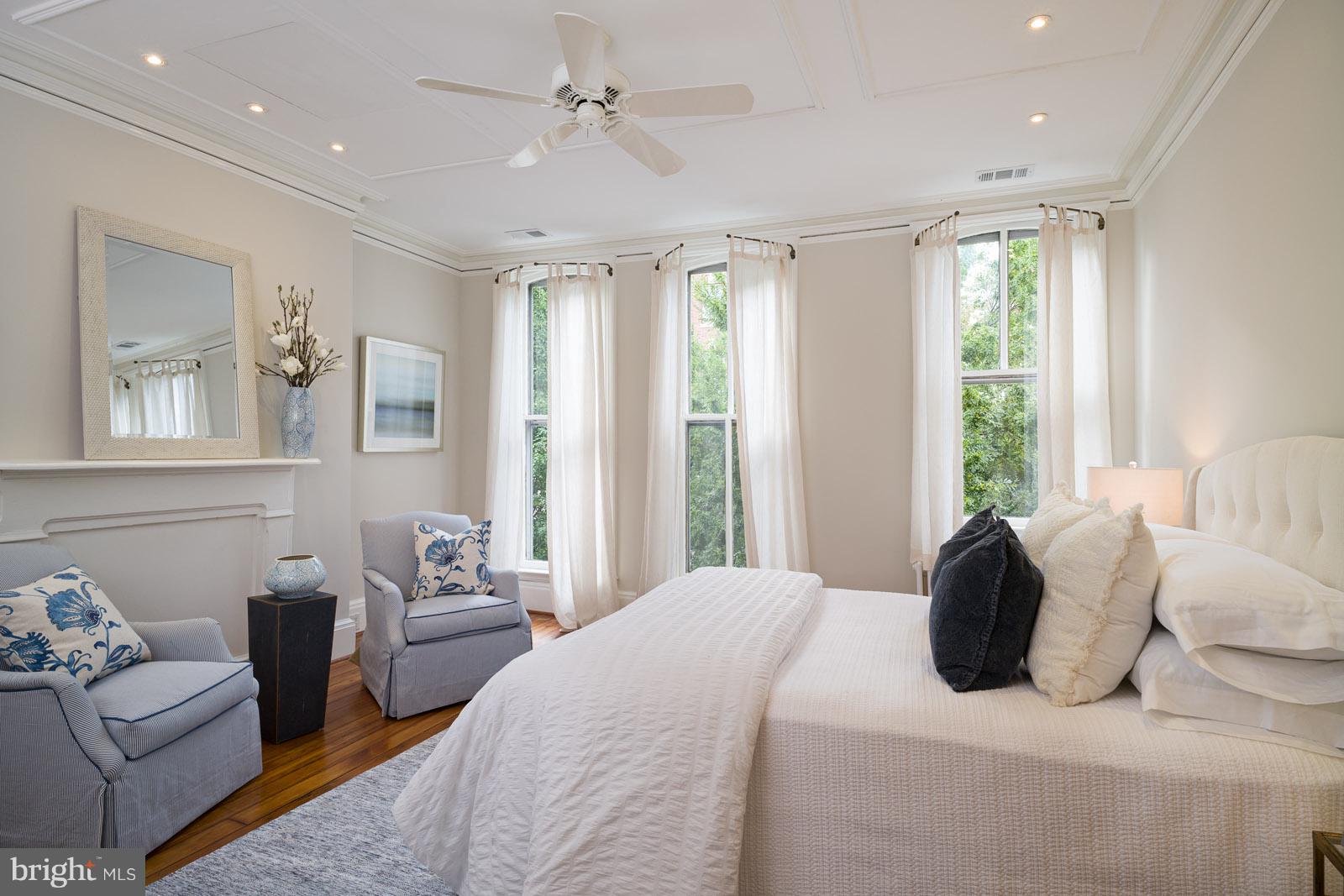 1833 12th Street Northwest Washington, DC 20009 - Photo 15 of 30 a bedroom with a bed couches and windows