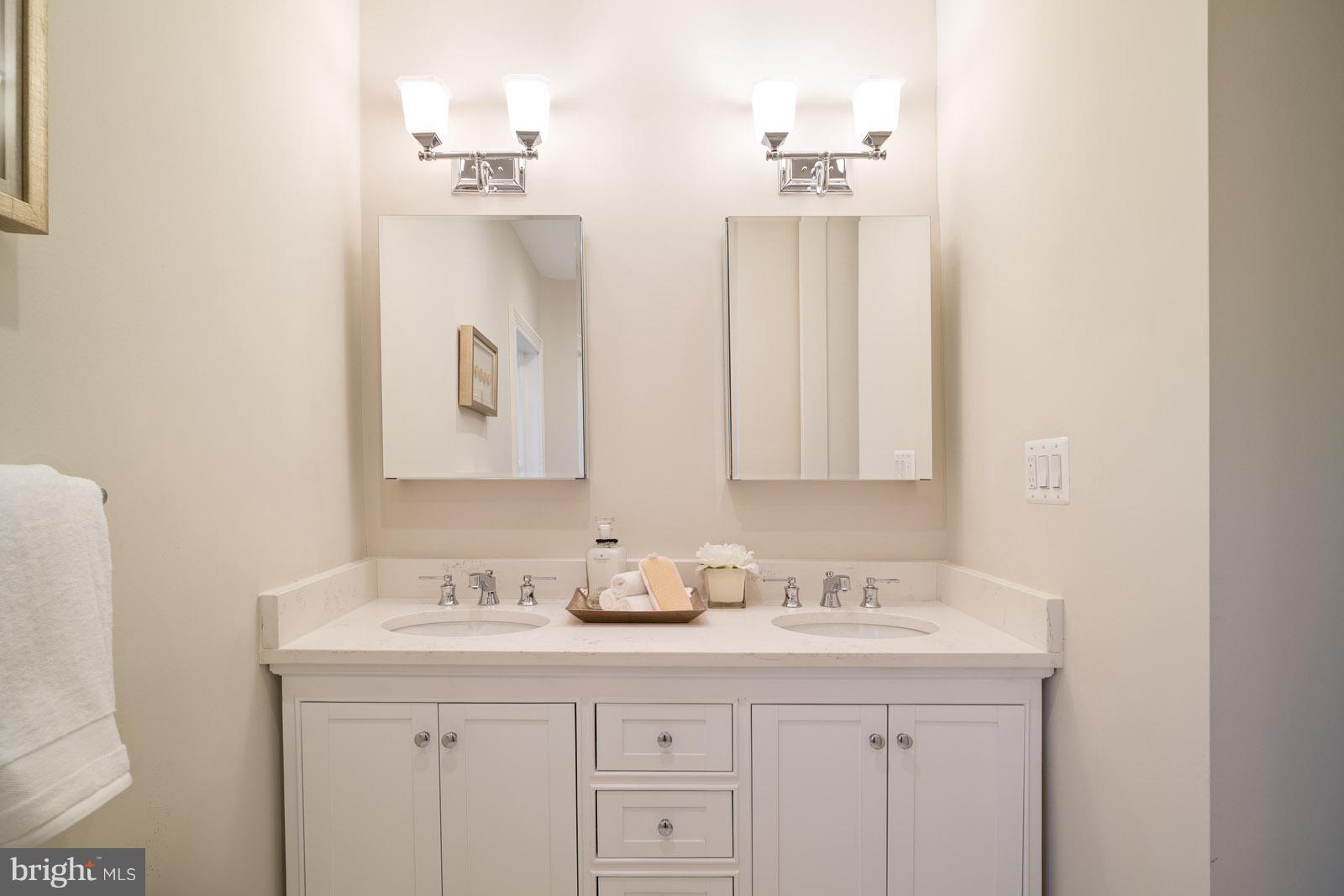 1833 12th Street Northwest Washington, DC 20009 - Photo 22 of 30 a bathroom with a double vanity sink and mirror