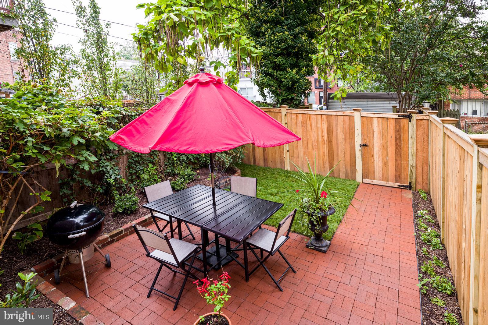1833 12th Street Northwest Washington, DC 20009 - Photo 24 of 30 a view of a backyard with sitting area and furniture