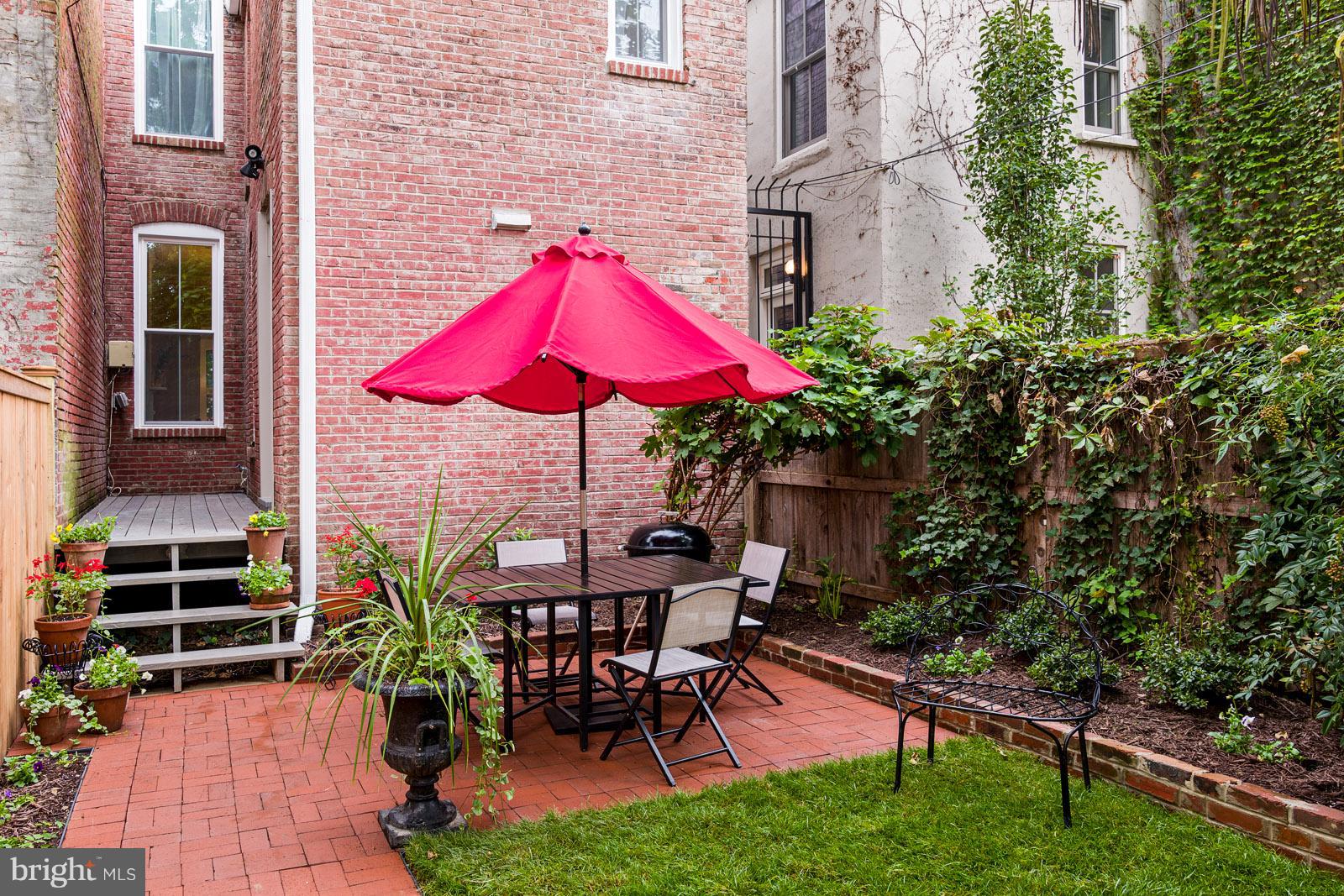 1833 12th Street Northwest Washington, DC 20009 - Photo 25 of 30 an outdoor space with furniture and umbrella