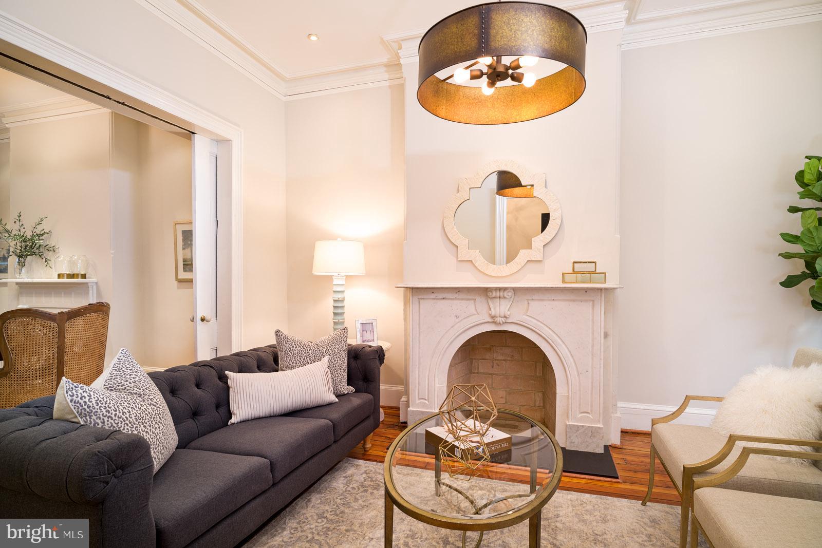1833 12th Street Northwest Washington, DC 20009 - Photo 4 of 30 a living room with furniture a fireplace and a window
