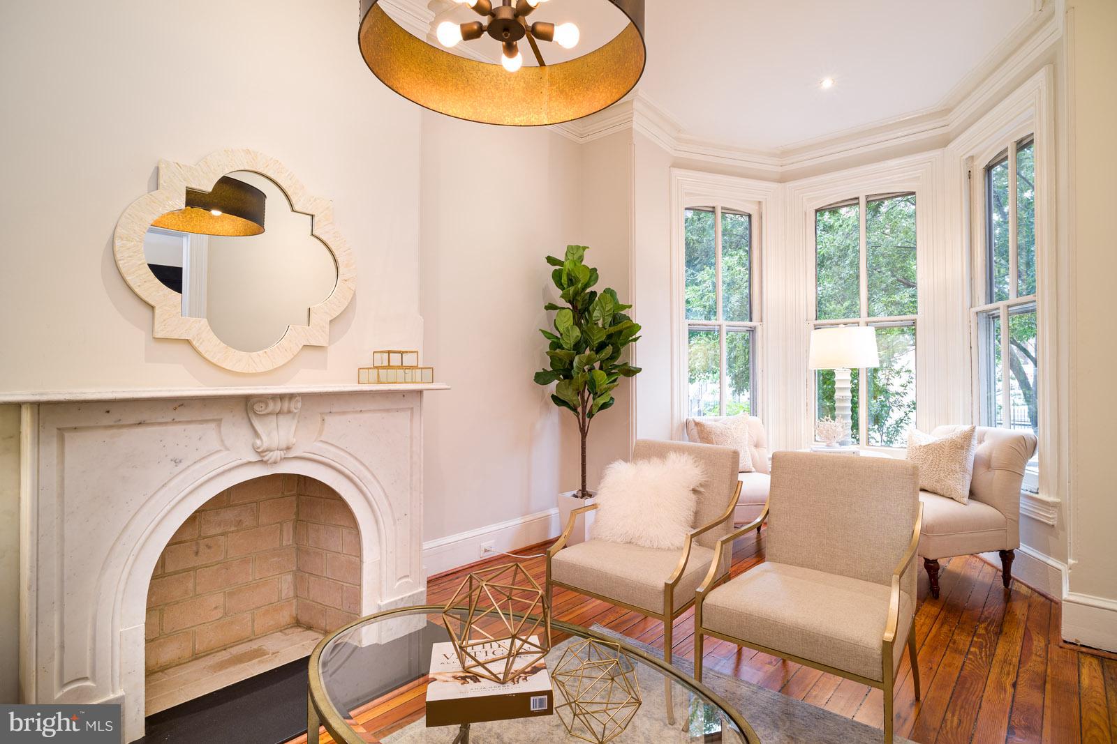 1833 12th Street Northwest Washington, DC 20009 - Photo 5 of 30 a living room with fireplace furniture and a large window