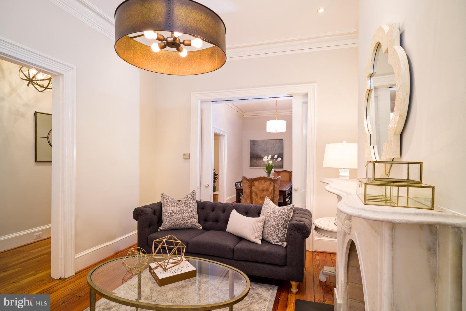 1833 12th Street Northwest Washington, DC 20009 - Photo 7 of 30 a living room with furniture a lamp and a large window