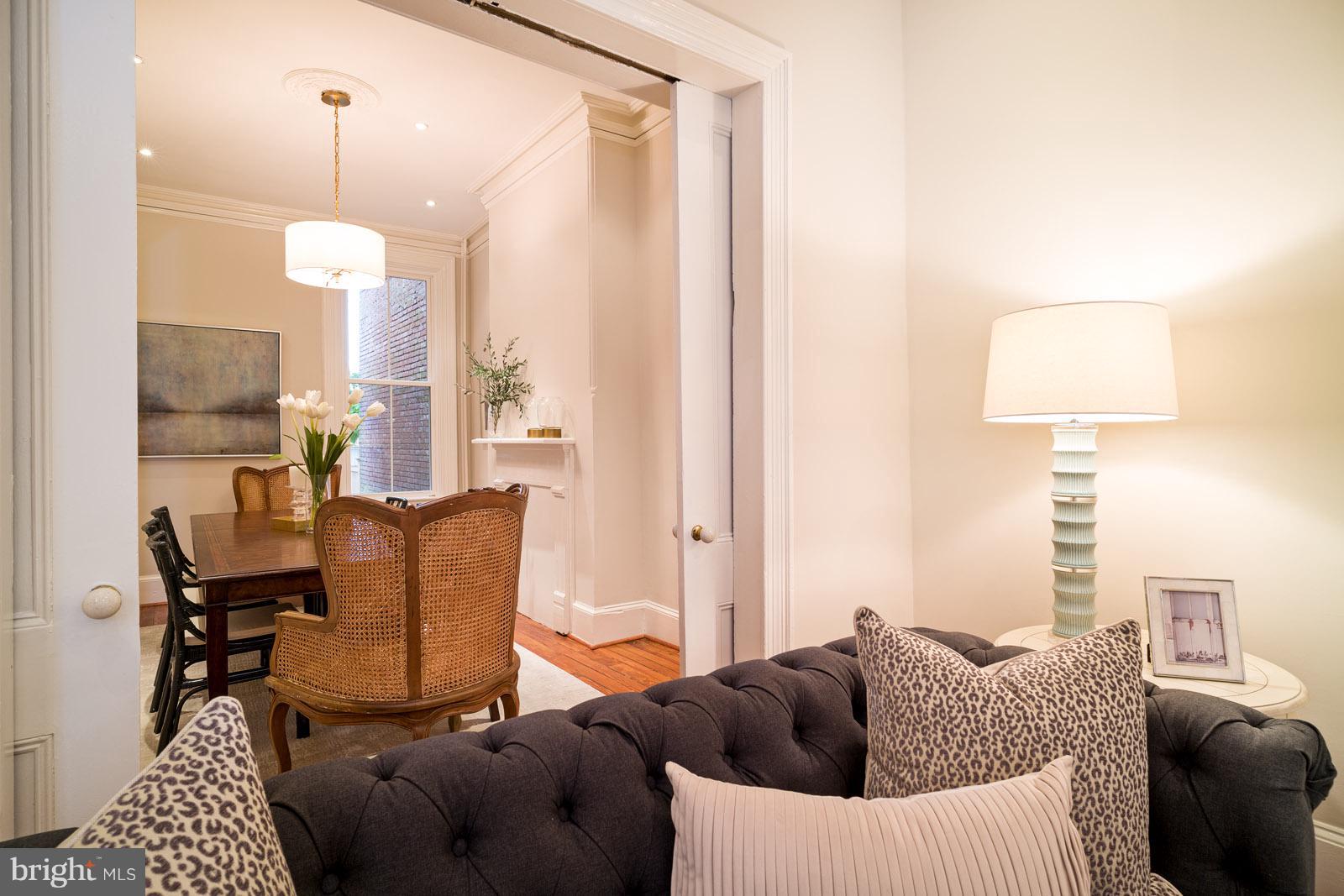 1833 12th Street Northwest Washington, DC 20009 - Photo 8 of 30 a living room with furniture a lamp and a chandelier