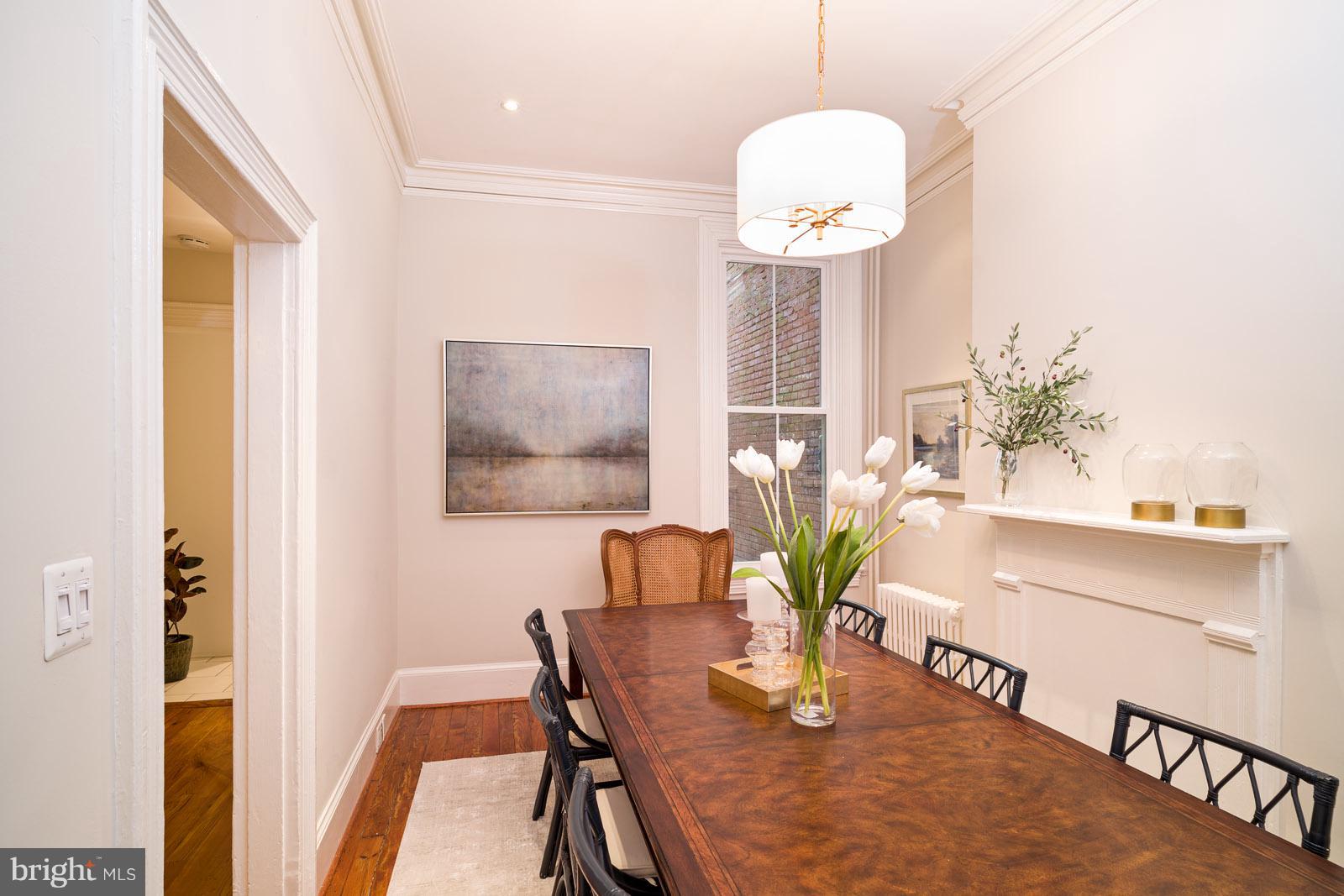 1833 12th Street Northwest Washington, DC 20009 - Photo 9 of 30 a dining room with furniture and wooden floor