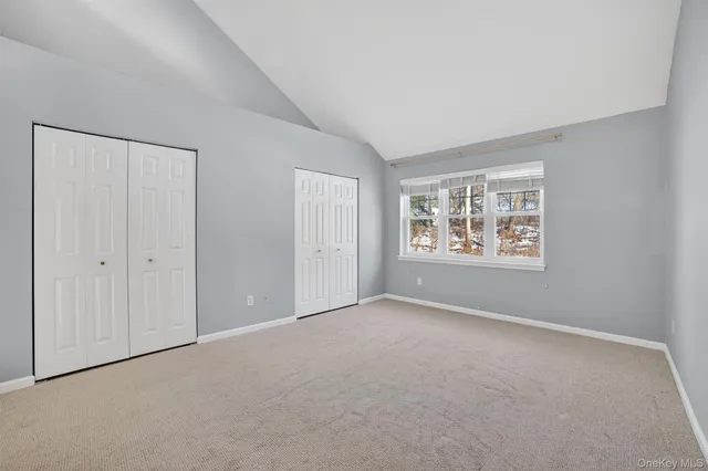 a view of storage and utility room with a hallway