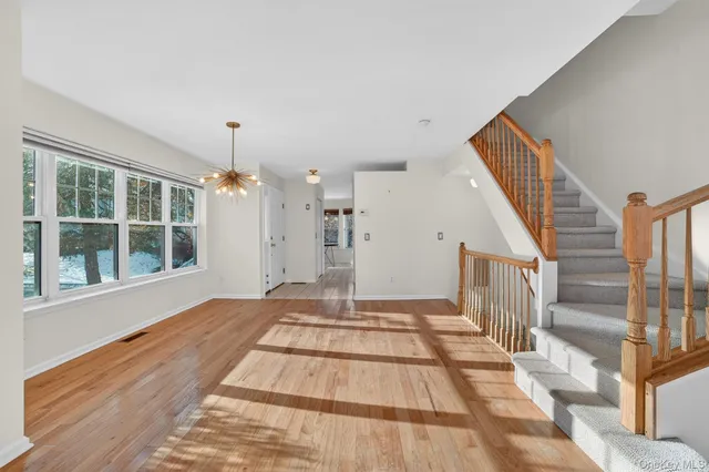 a kitchen with cabinets stainless steel appliances and a sink