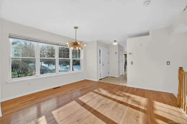 a kitchen with white cabinets stainless steel appliances and a sink