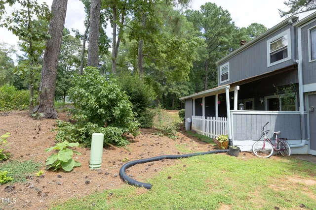 a view of a house with a small yard