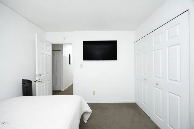 a bedroom with a bed and a table