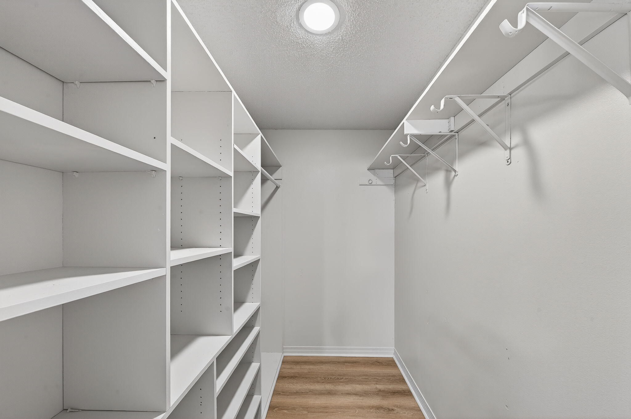 932 Ridgewood Way Niceville, FL 32578 - Photo 35 of 47 a view of walk in closet with empty racks