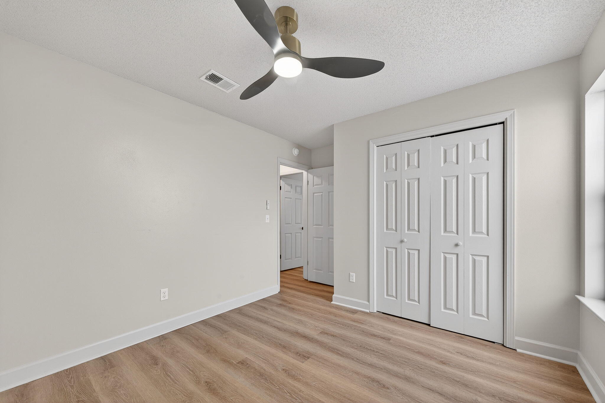 932 Ridgewood Way Niceville, FL 32578 - Photo 36 of 47 wooden floor in an empty room