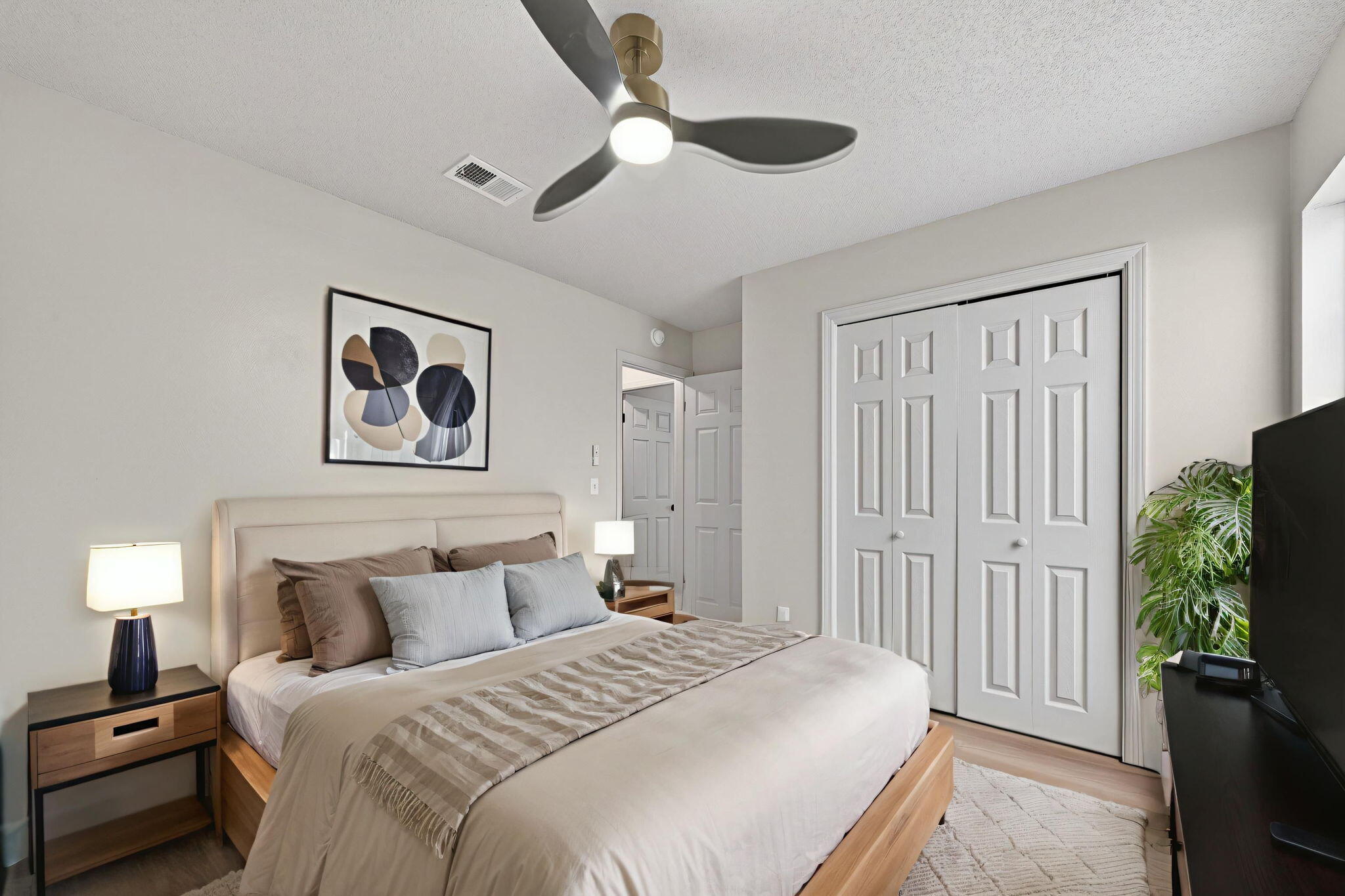 932 Ridgewood Way Niceville, FL 32578 - Photo 37 of 47 a spacious bedroom with a bed and a chandelier