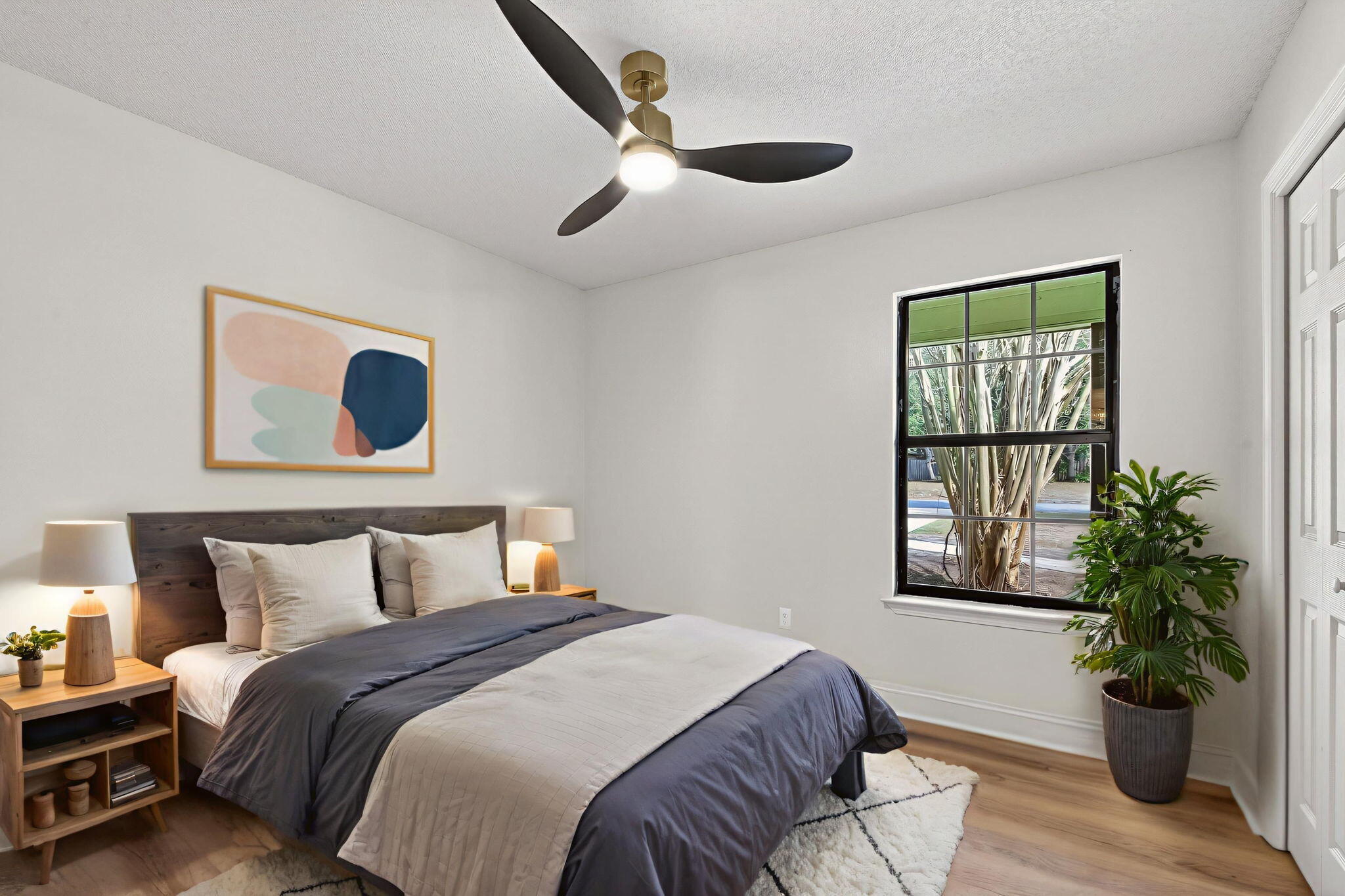 932 Ridgewood Way Niceville, FL 32578 - Photo 39 of 47 a bedroom with a large bed and a potted plant