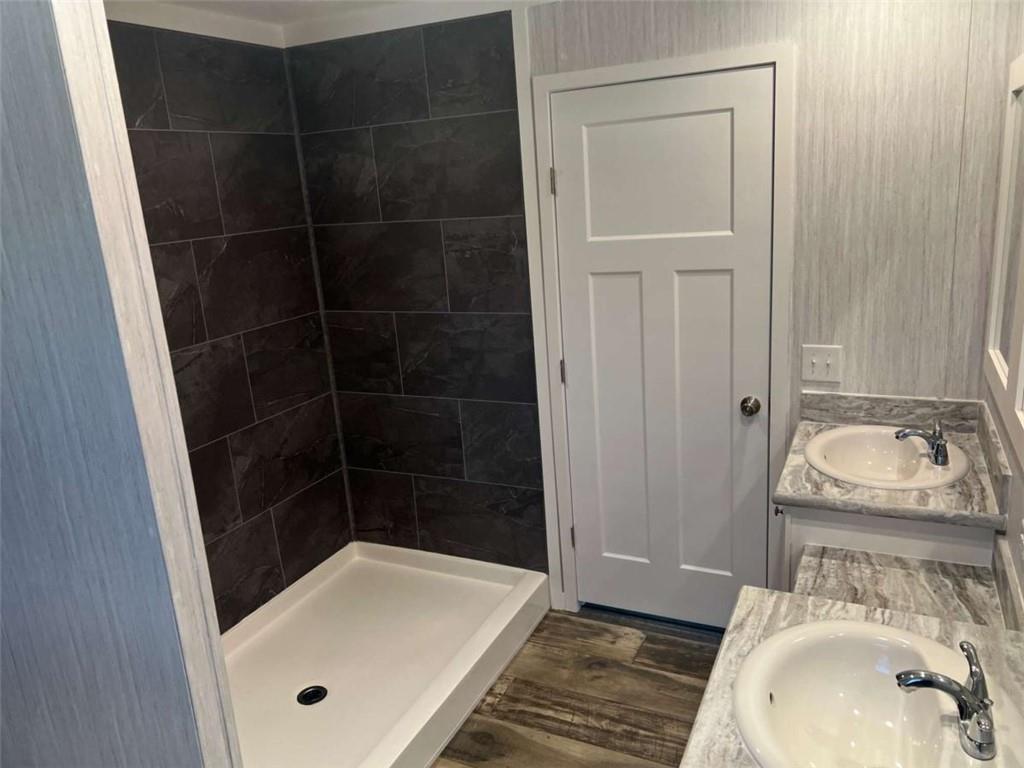 5041 Young Road Gainesville, GA 30506 - Photo 15 of 18 a bathroom with a sink and a tub