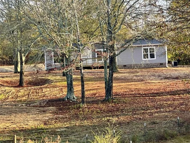 a view of a backyard of the house