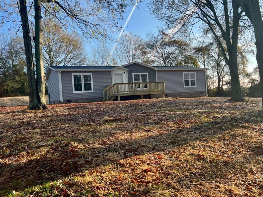 5041 Young Road Gainesville, GA 30506 - Photo 4 of 18 a house that has a tree in front of it