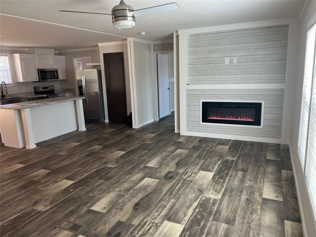 5041 Young Road Gainesville, GA 30506 - Photo 5 of 18 a view of kitchen with granite countertop cabinets and refrigerator