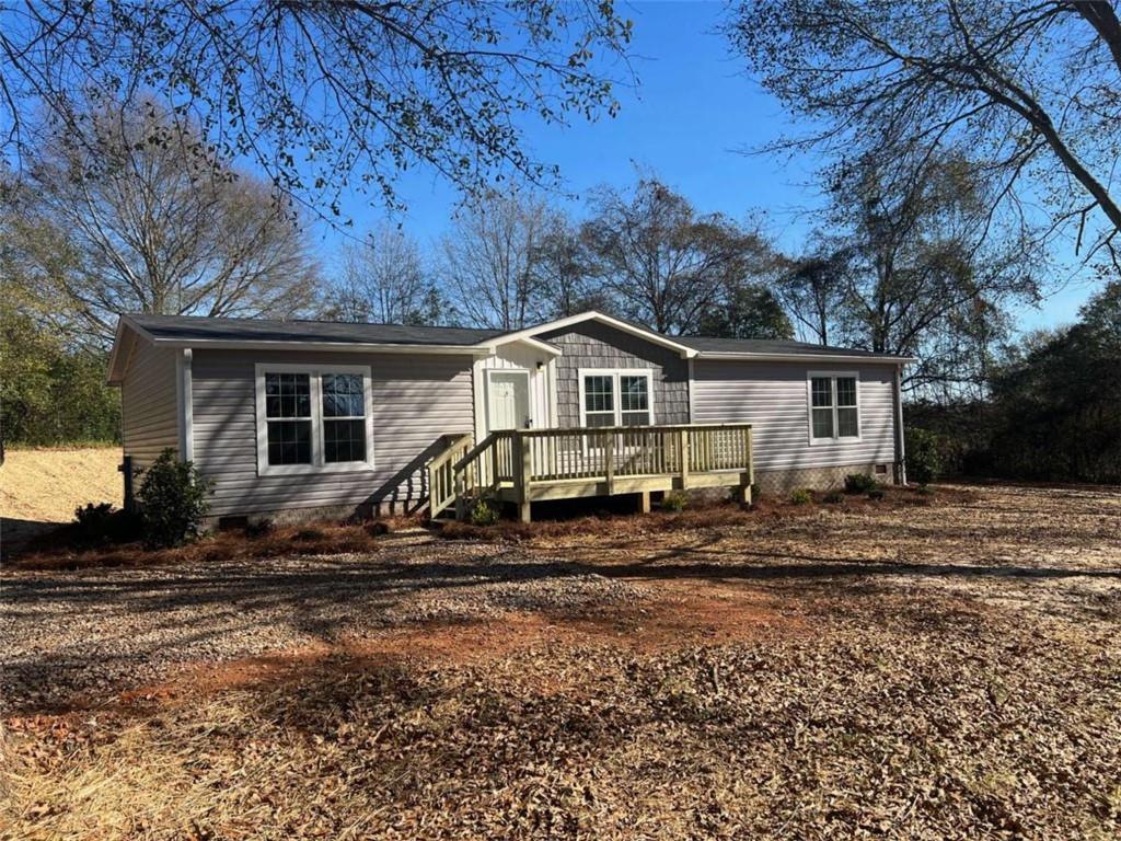 5041 Young Road Gainesville, GA 30506 - Photo 8 of 18 a view of house with backyard and trees