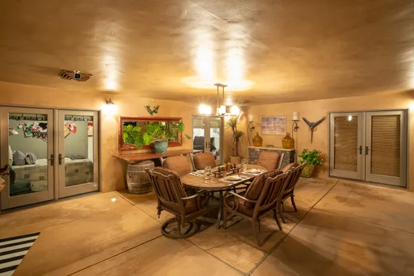 a view of a dining table and chairs in the patio