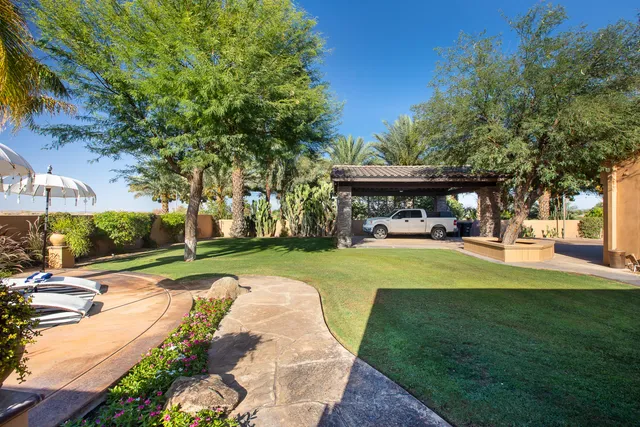 a view of a swimming pool with lounge chairs