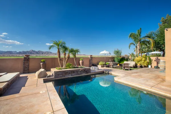 a view of a backyard with sitting area