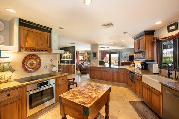 a living room with furniture a table and a large window
