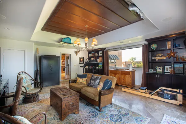 a dining room with furniture a rug and wooden floor