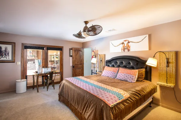 a bedroom with a bed and a television in it