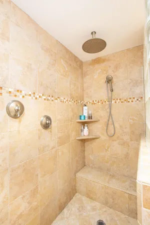 a bathroom with a sink double vanity and a mirror
