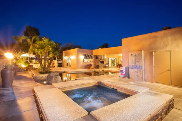 a view of a patio with a table and chairs