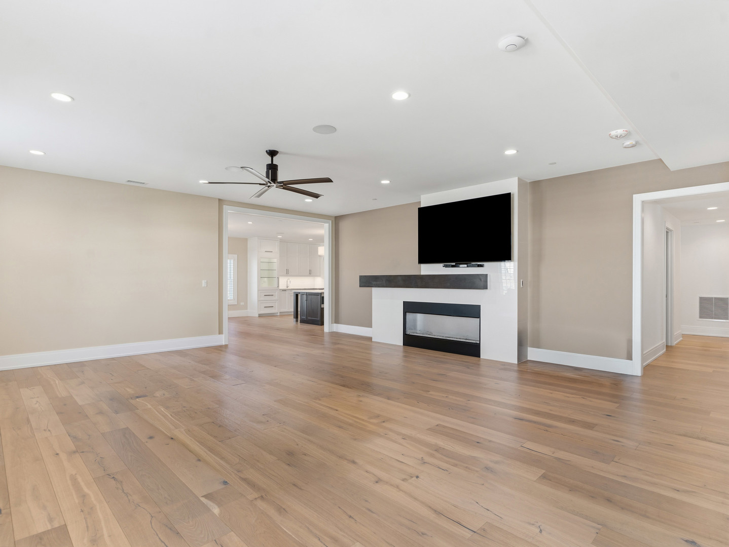 110 South Washington Street, Unit 400 Naperville, IL 60540 - Photo 12 of 54 a view of empty room with wooden floor and fireplace