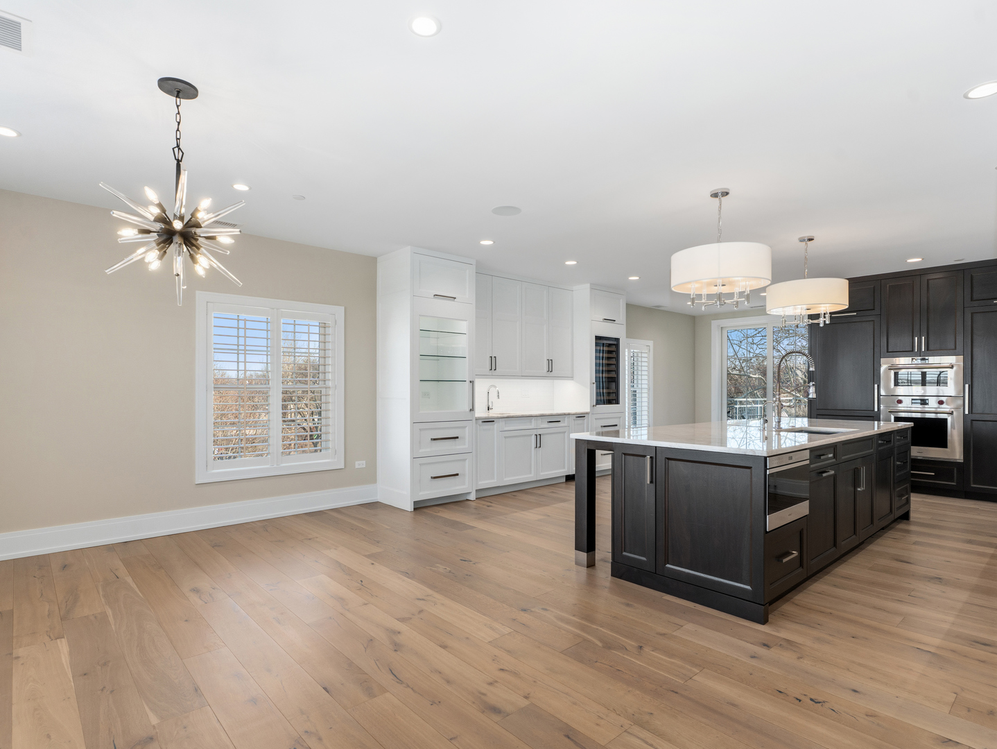 110 South Washington Street, Unit 400 Naperville, IL 60540 - Photo 14 of 54 a kitchen with stainless steel appliances kitchen island hardwood floor sink stove and wooden floor