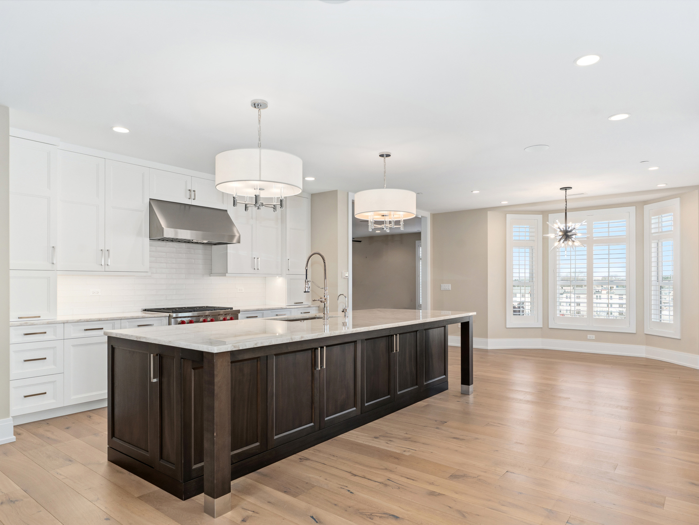 110 South Washington Street, Unit 400 Naperville, IL 60540 - Photo 16 of 54 a kitchen with a stove and wooden floor