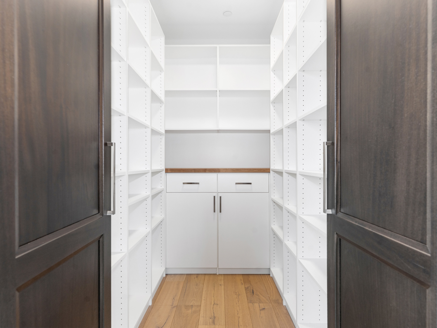 110 South Washington Street, Unit 400 Naperville, IL 60540 - Photo 19 of 54 a view of a room with wooden floor and white walls
