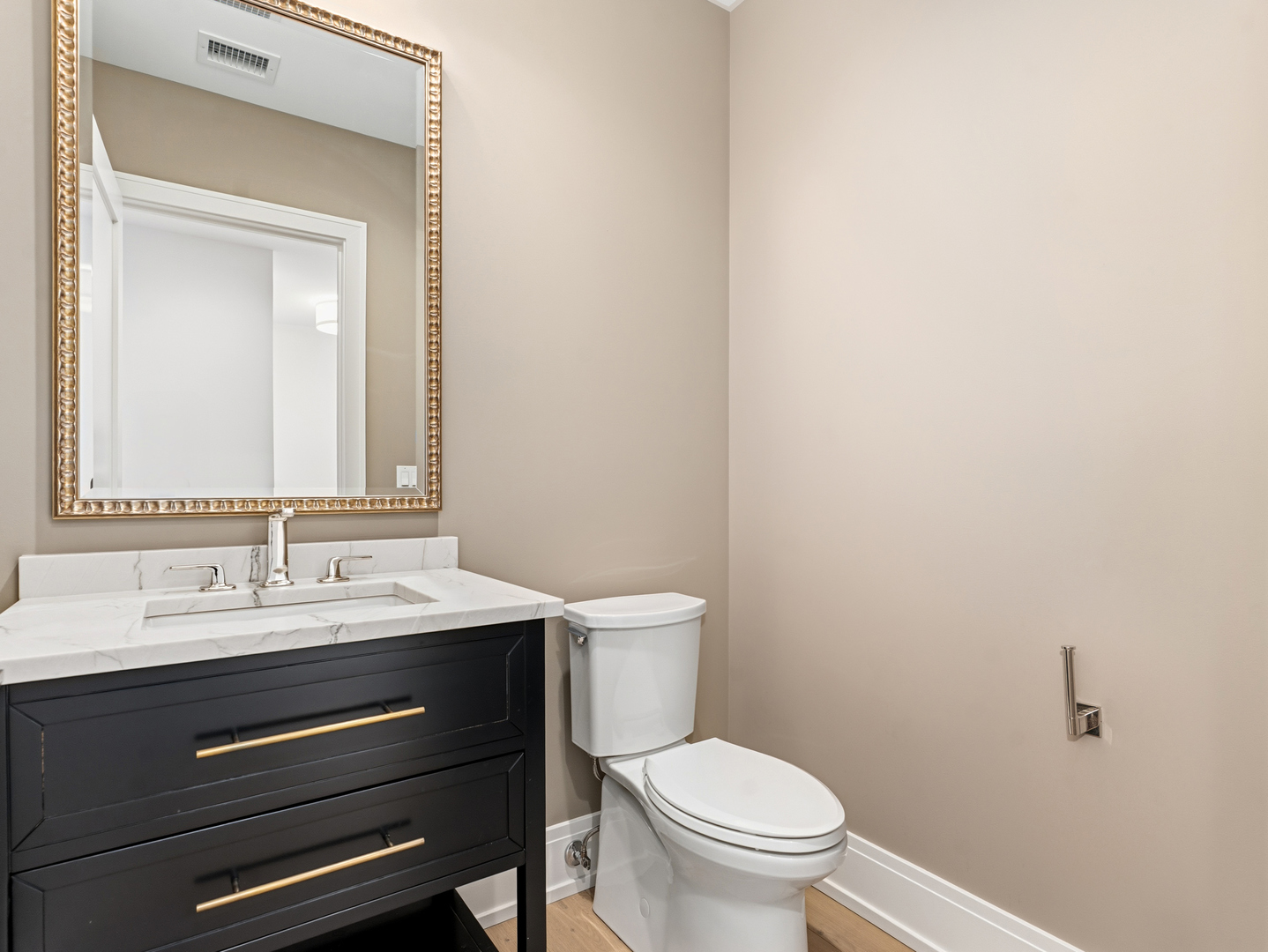 110 South Washington Street, Unit 400 Naperville, IL 60540 - Photo 25 of 54 a bathroom with a toilet a sink and mirror
