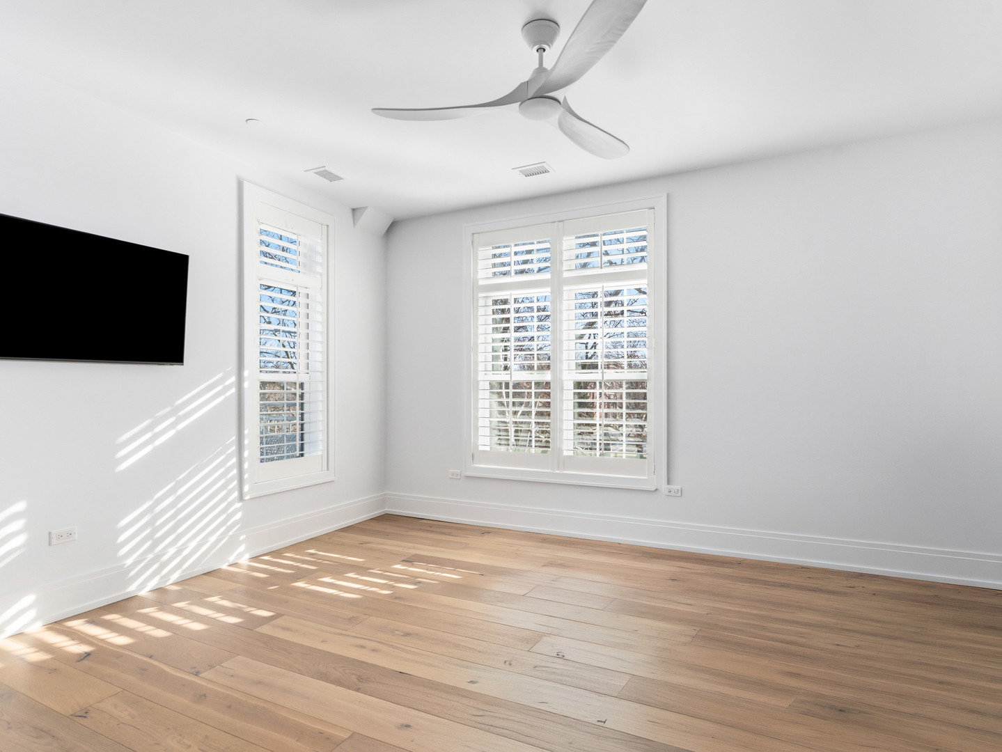110 South Washington Street, Unit 400 Naperville, IL 60540 - Photo 37 of 54 a view of an empty room with a flat screen tv