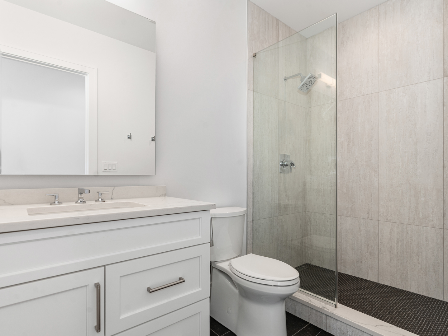 110 South Washington Street, Unit 400 Naperville, IL 60540 - Photo 38 of 54 a bathroom with a sink a toilet and shower