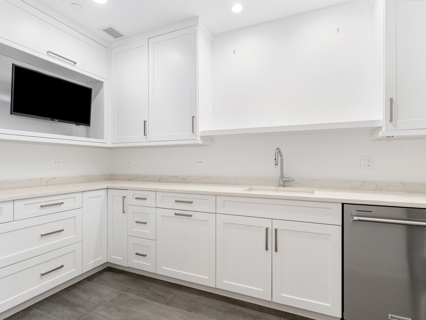 110 South Washington Street, Unit 400 Naperville, IL 60540 - Photo 41 of 54 a kitchen with white cabinets stainless steel appliances and sink