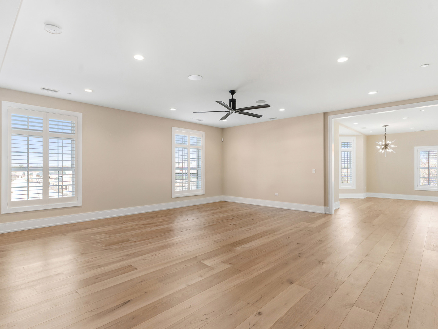 110 South Washington Street, Unit 400 Naperville, IL 60540 - Photo 8 of 54 a view of an empty room with wooden floor and a window