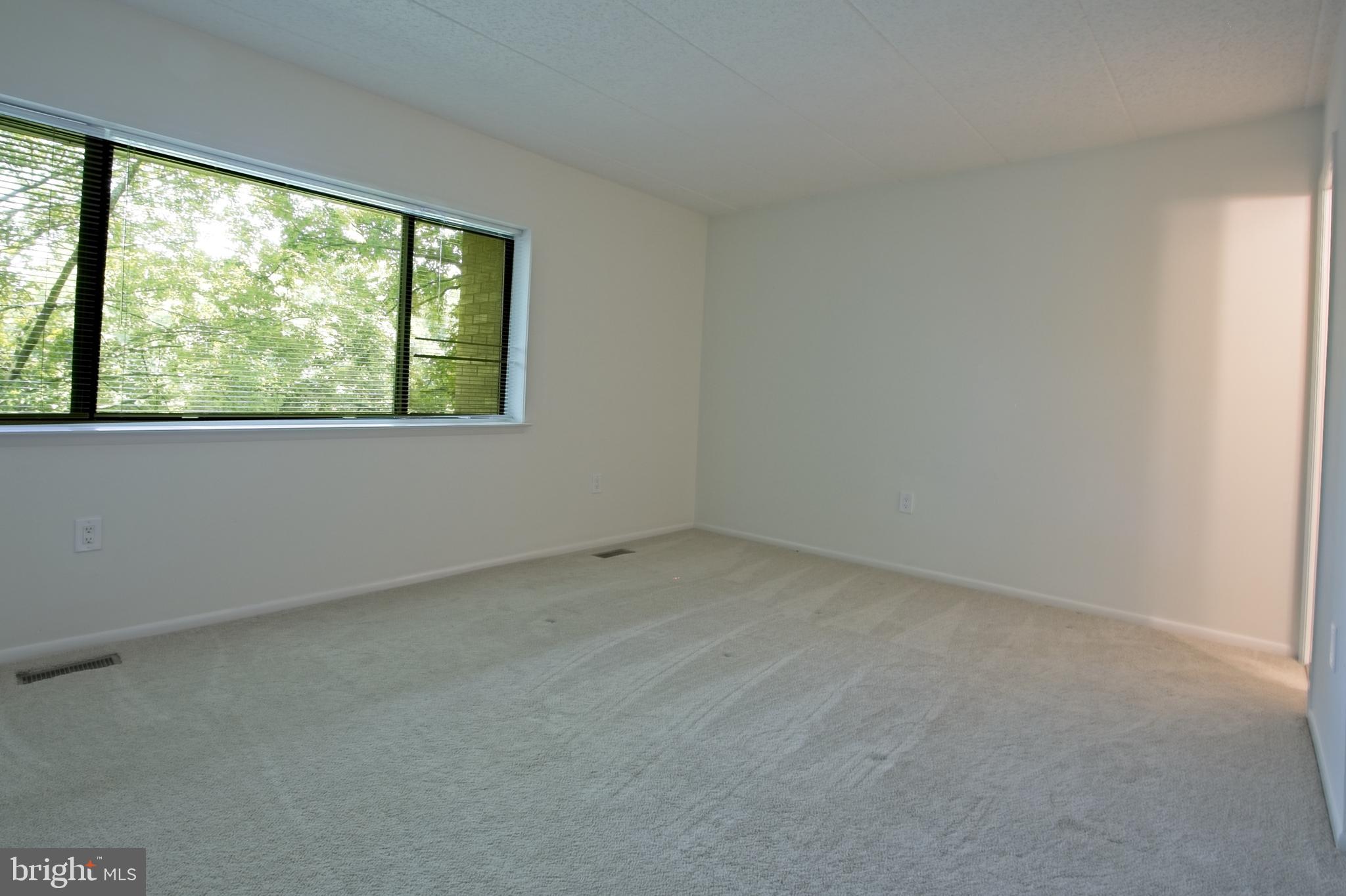 11108 Boathouse Court, Unit 97 Reston, VA 20191 - Photo 15 of 28 Primary bedroom with large window to the lake